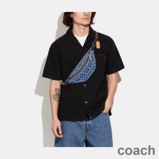 Geantă cu curea Coach Charter 7 în denim semnătură bleumarin