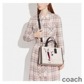 Coach Dempsey Carryall aus strukturiertem Leder mit Disney Cruella-Motiv, Beige