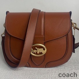 Coach Georgie Satteltasche aus Kieselleder und Glattleder Braun