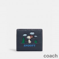 Portfel Coach Snap w kolorze Pebble Leather z motywem narciarskim Peanuts Snoopy w kolorze granatowym