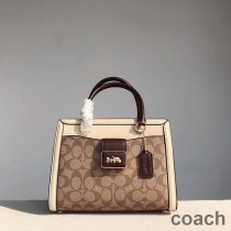 Torba podróżna Coach Grace Carryall w kolorze Signature Canvas i Snake Leather w kolorze khaki/białym