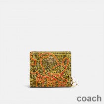 Portfel Coach Snap Wallet x Disney Mickey Mouse x Keith Haring w kolorze Pebble Leather Yellow
