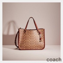 Torba podróżna Coach Tyler Carryall 28 w kolorze Signature Canvas Khaki/Burgund