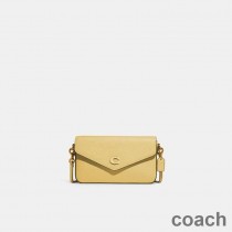 Torba typu crossbody Coach Wyn ze skóry licowej w kolorze żółtym
