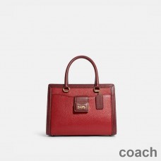 Torba podróżna Coach Grace Carryall w kolorze Pebble Leather w kolorze czerwonym/bordowym