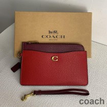 Bolso de mano Coach L Zip en piel granulada con bloques de color rojo y burdeos